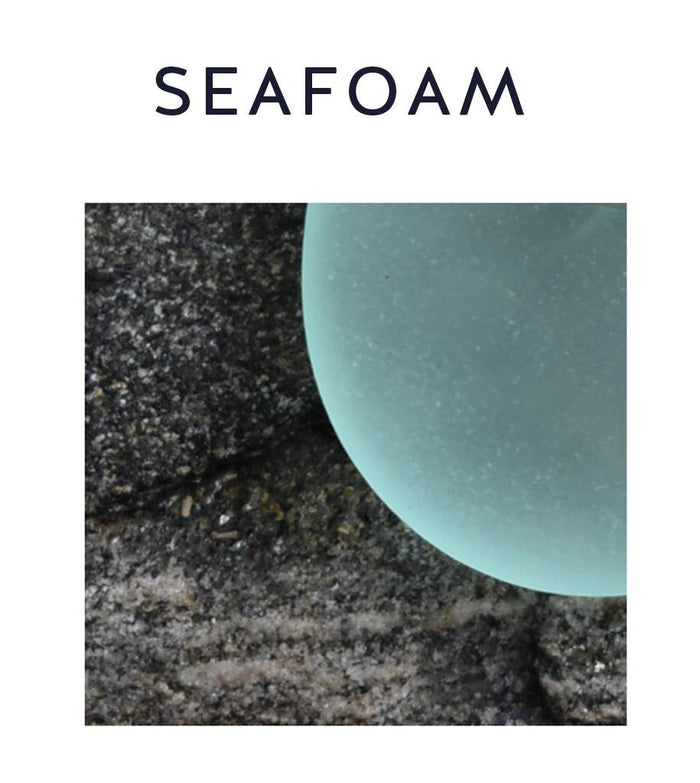 Close-up view of Aqua Eco Glass Circle Pendant Necklace showcasing the smooth, frosted surface of the aqua Eco Glass against shimmering sterling silver.