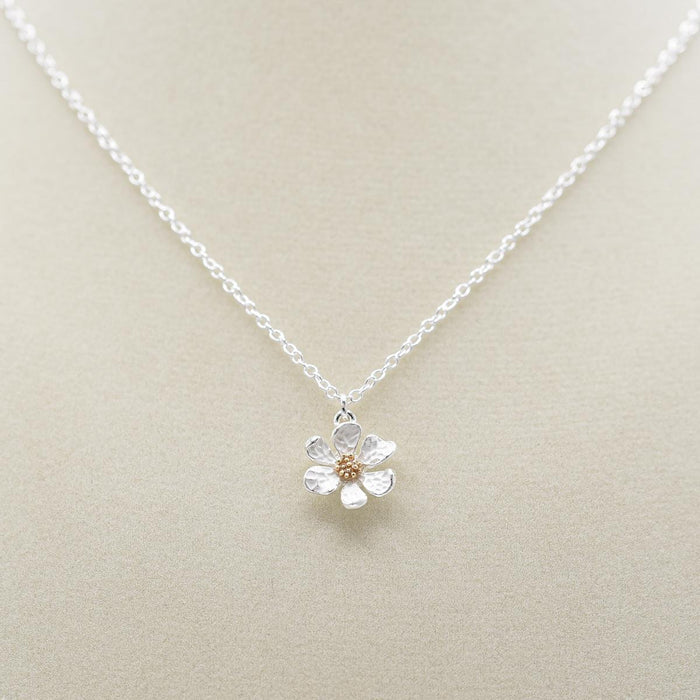 Elizabeth Jewelry Hammered Flower Necklace on jewelry form