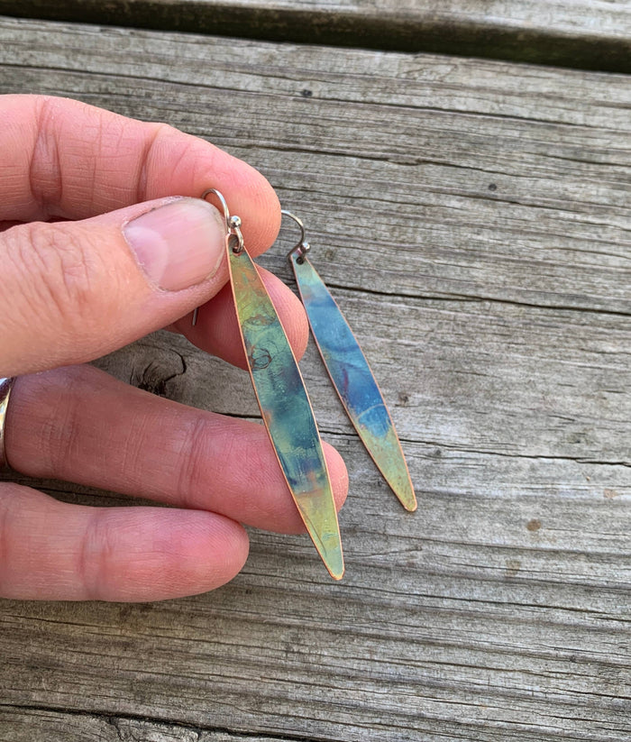 Long Oval dangle earrings by Positive Shine Jewelry featuring slender fire-painted copper ovals on stainless steel ear wires