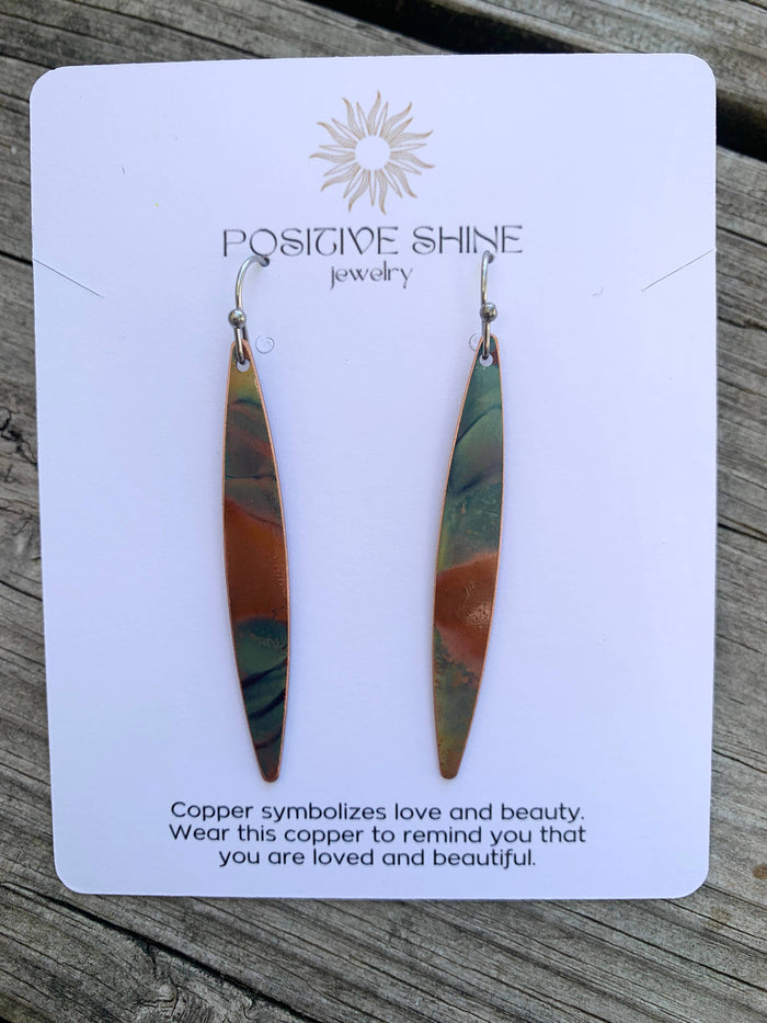 Long Oval dangle earrings with colorful fire-painted copper design, lightweight construction, and stainless steel ear wires
