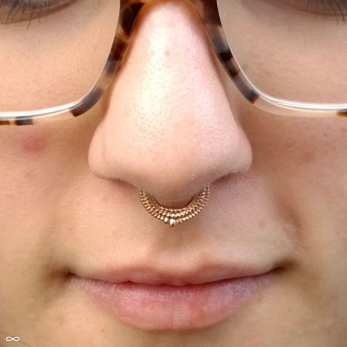 Septum piercing with Melange Clicker from Tether Jewelry in Yellow Gold