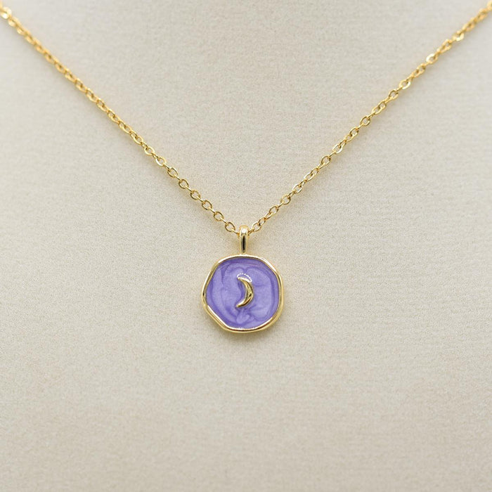 Moon On Purple Disk Necklace on jewelry form