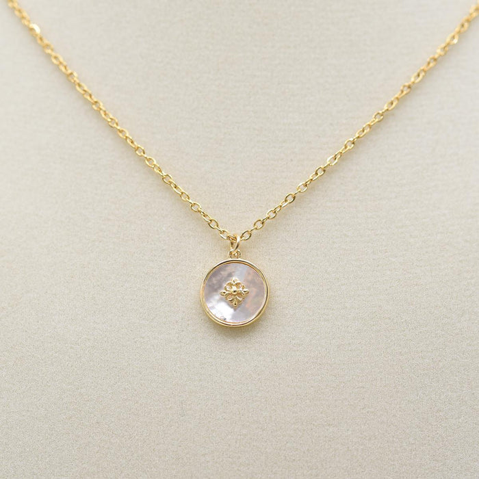 Mother of Pearl Disk Necklace on jewelry form