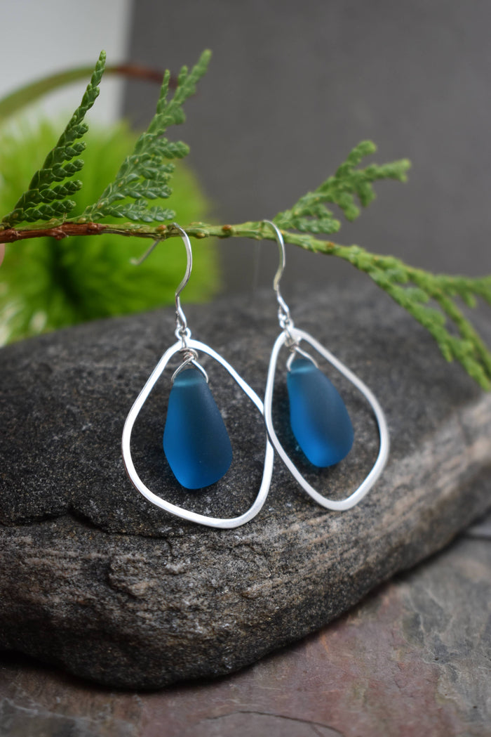 Close-up of Organic Eco Glass Earrings, highlighting the frosted seafoam finish made from recycled materials.