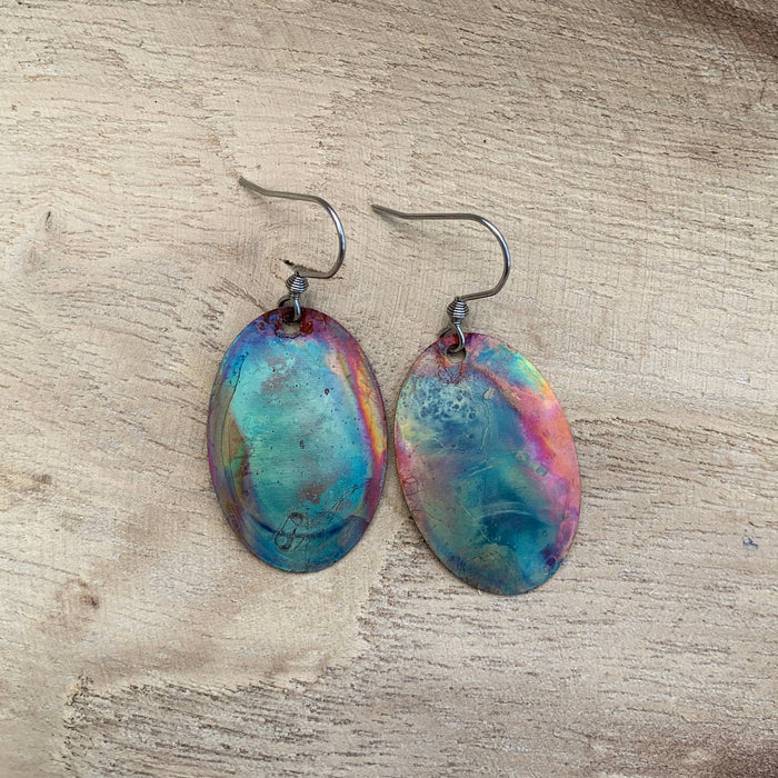 Oval Copper Earrings featuring colorful fire-painted patterns on lightweight oval copper jewelry
