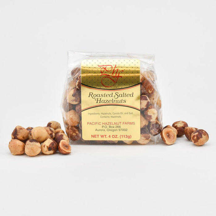 Packaged roasted salted hazelnuts with a visible brand label on a white background