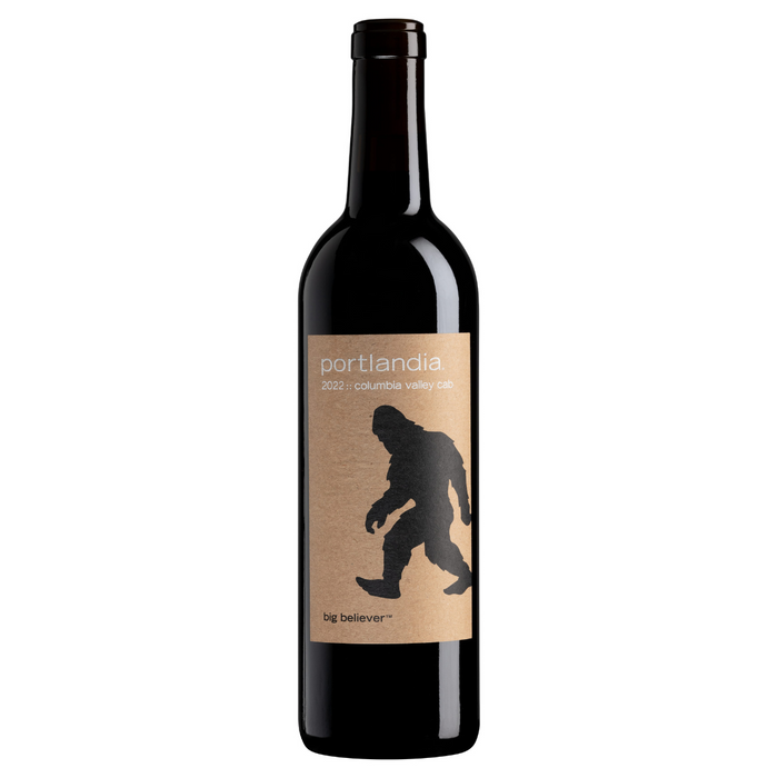 A bottle of Portlandia Cabernet Big Believer wine with a label featuring a silhouette of a Sasquatch.